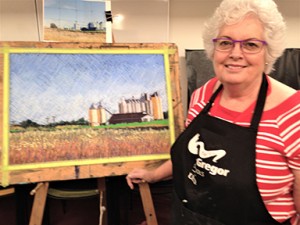 Margy Cruickshank with a painting to be displayed in the exhibition